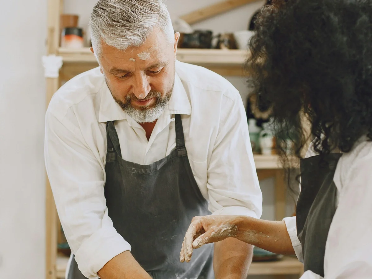 Diverse group working together in a hands-on pottery workshop