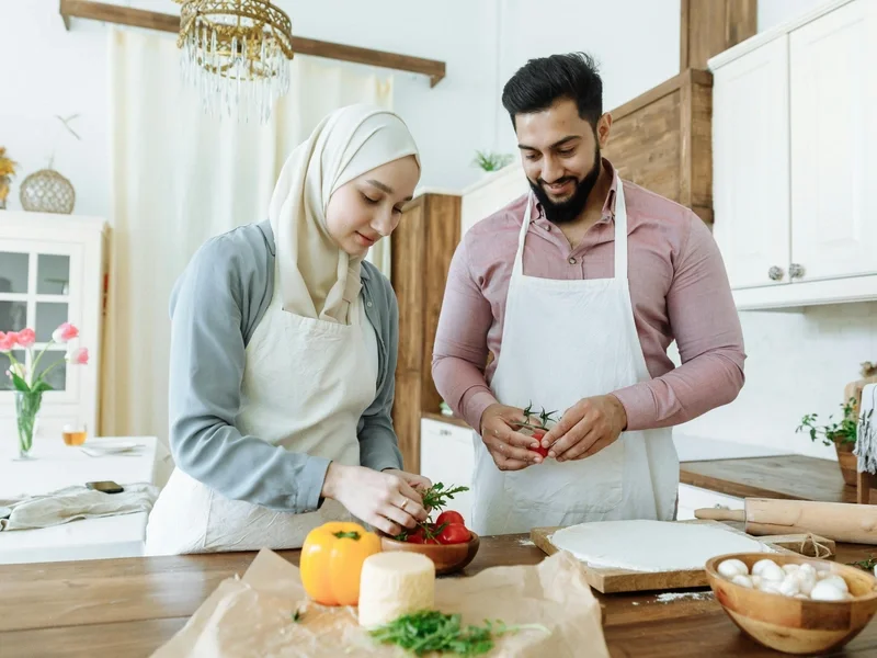 Diverse couple cooking together in a bright kitchen