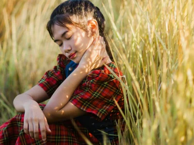 Serene teen girl resting peacefully in nature