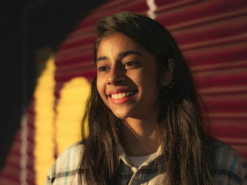 Woman smiling in warm evening sunlight