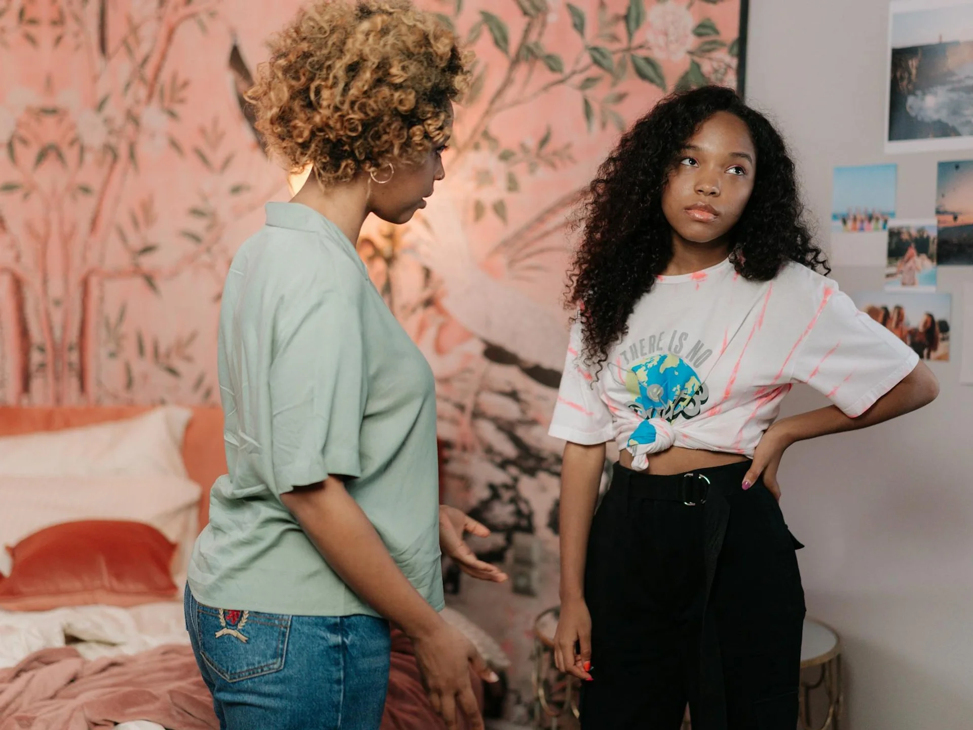 Mother and teen daughter in a tense conversation at home