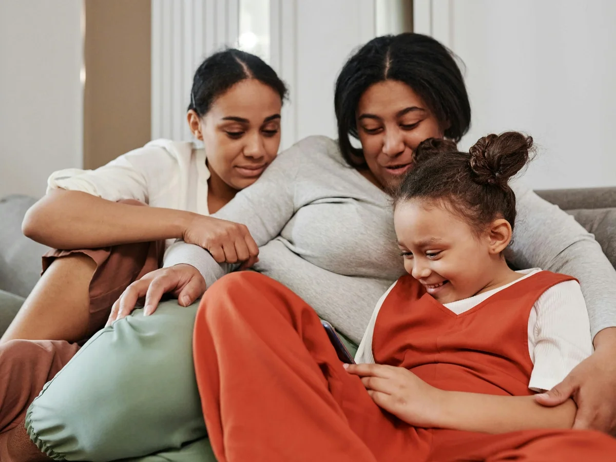 Three generations of a family enjoying a warm moment together indoors