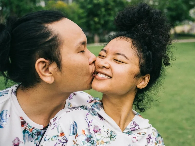 Happy couple sharing a loving moment in a park